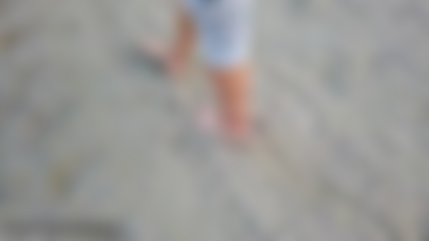 Feet and toes in the sand walking stairs